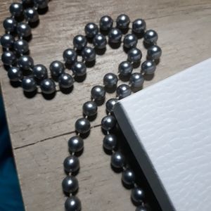 Light, deep blue pearl necklace